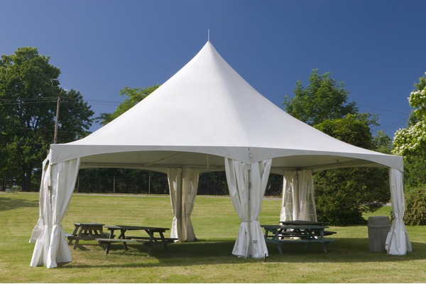 White high peak tent rental setup for weddings and events in Central Florida