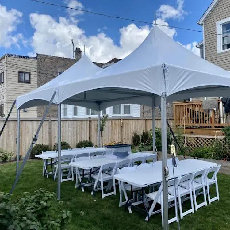 10x20 High Peak Tent rental with banquet table setup in backyard